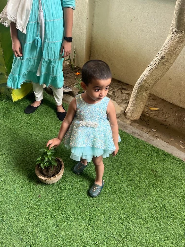 Child planting and gardening during outdoor learning