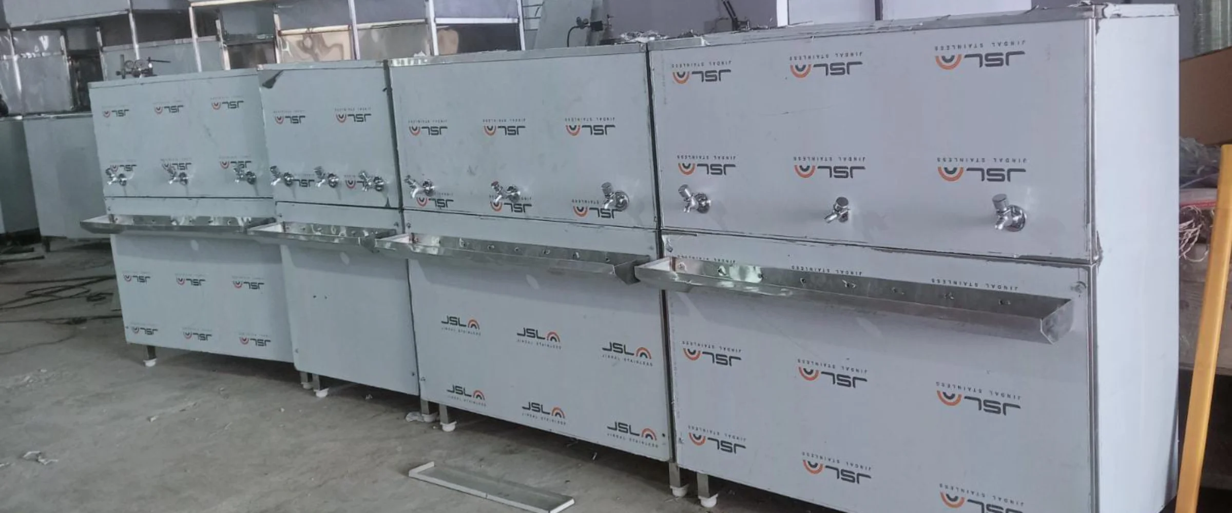 Stainless steel water coolers lined up inside the Mount Star manufacturing unit