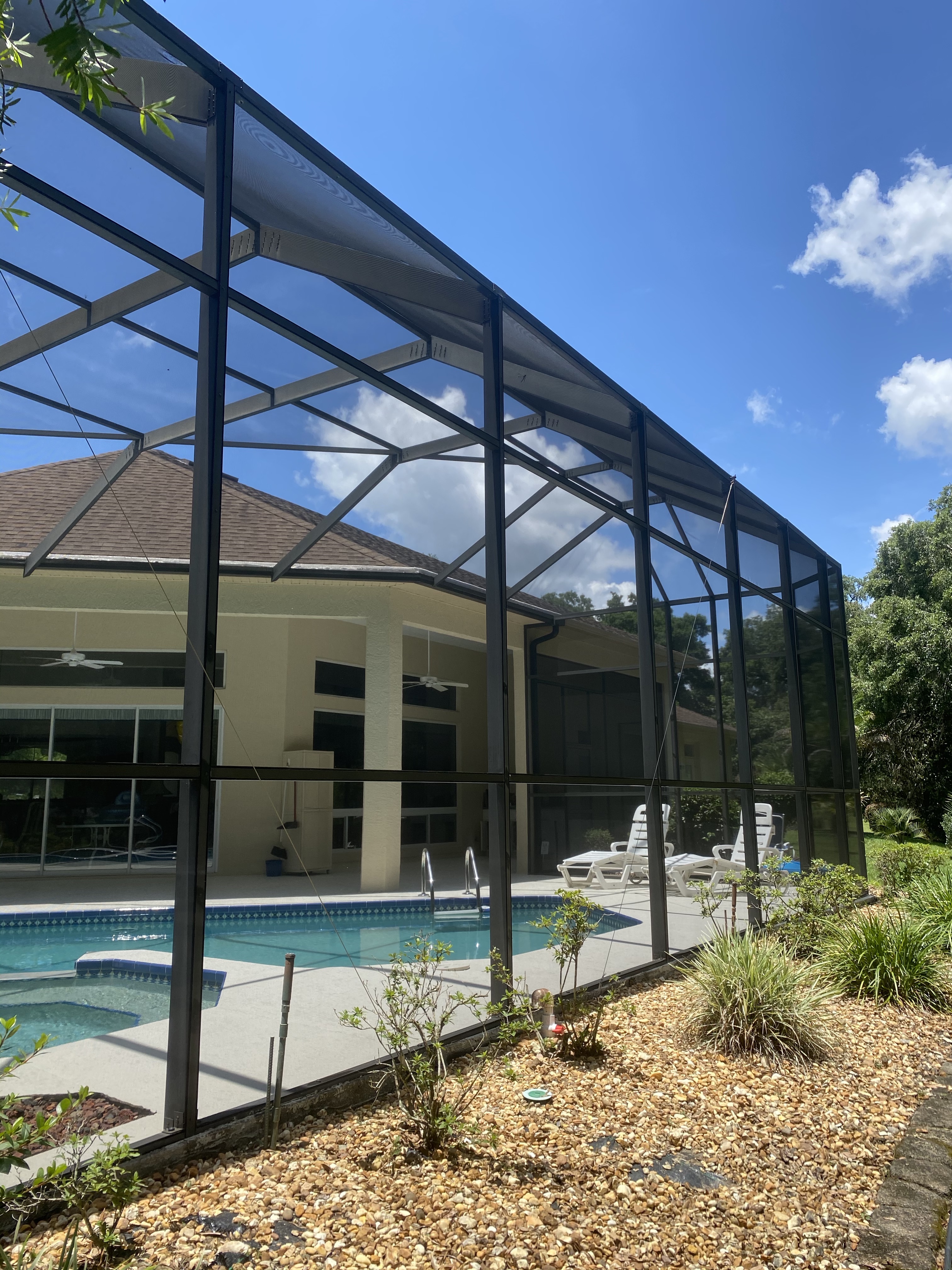 Clean pool cage after pressure washing in Ocala