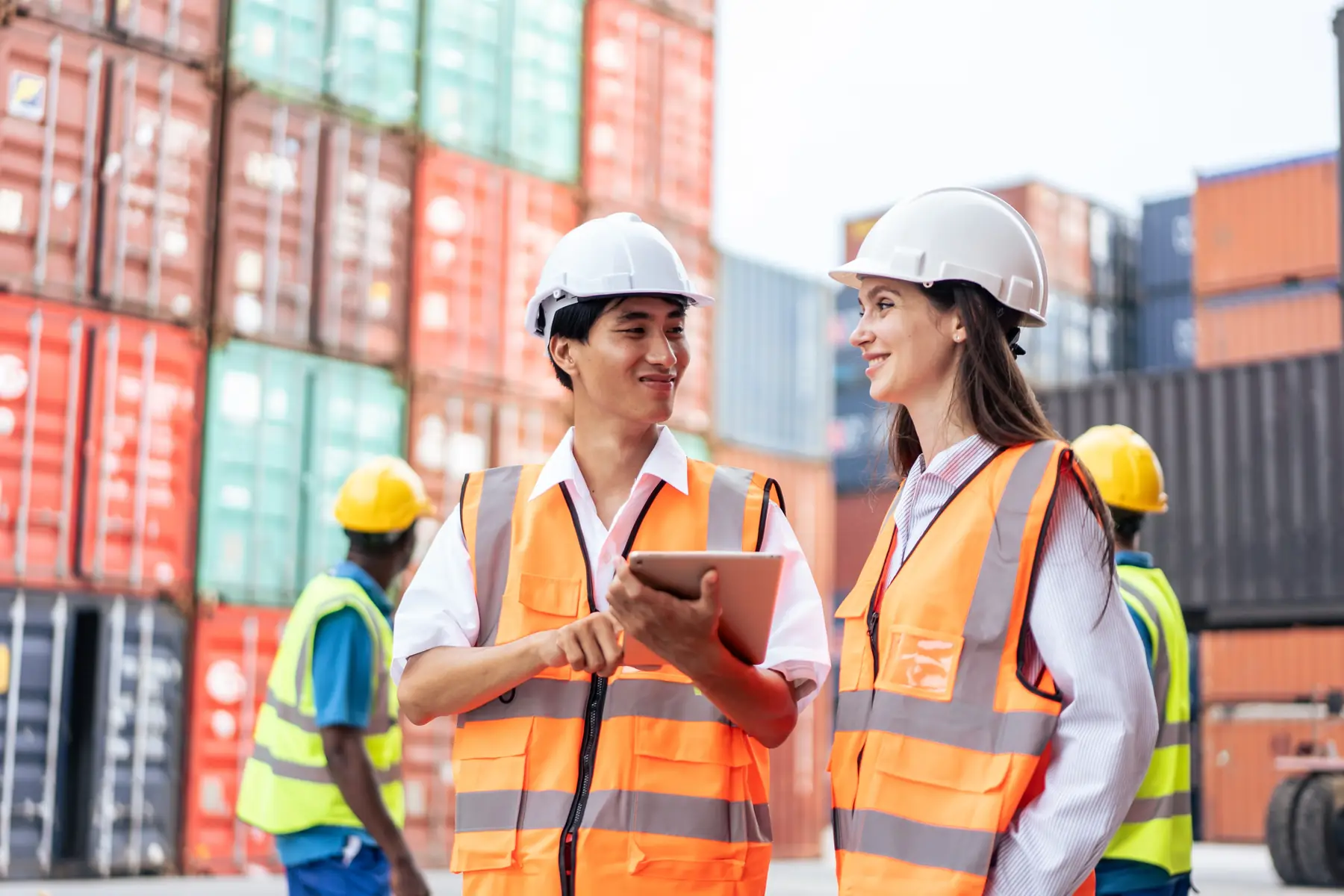Field team consulting on-site at a container terminal